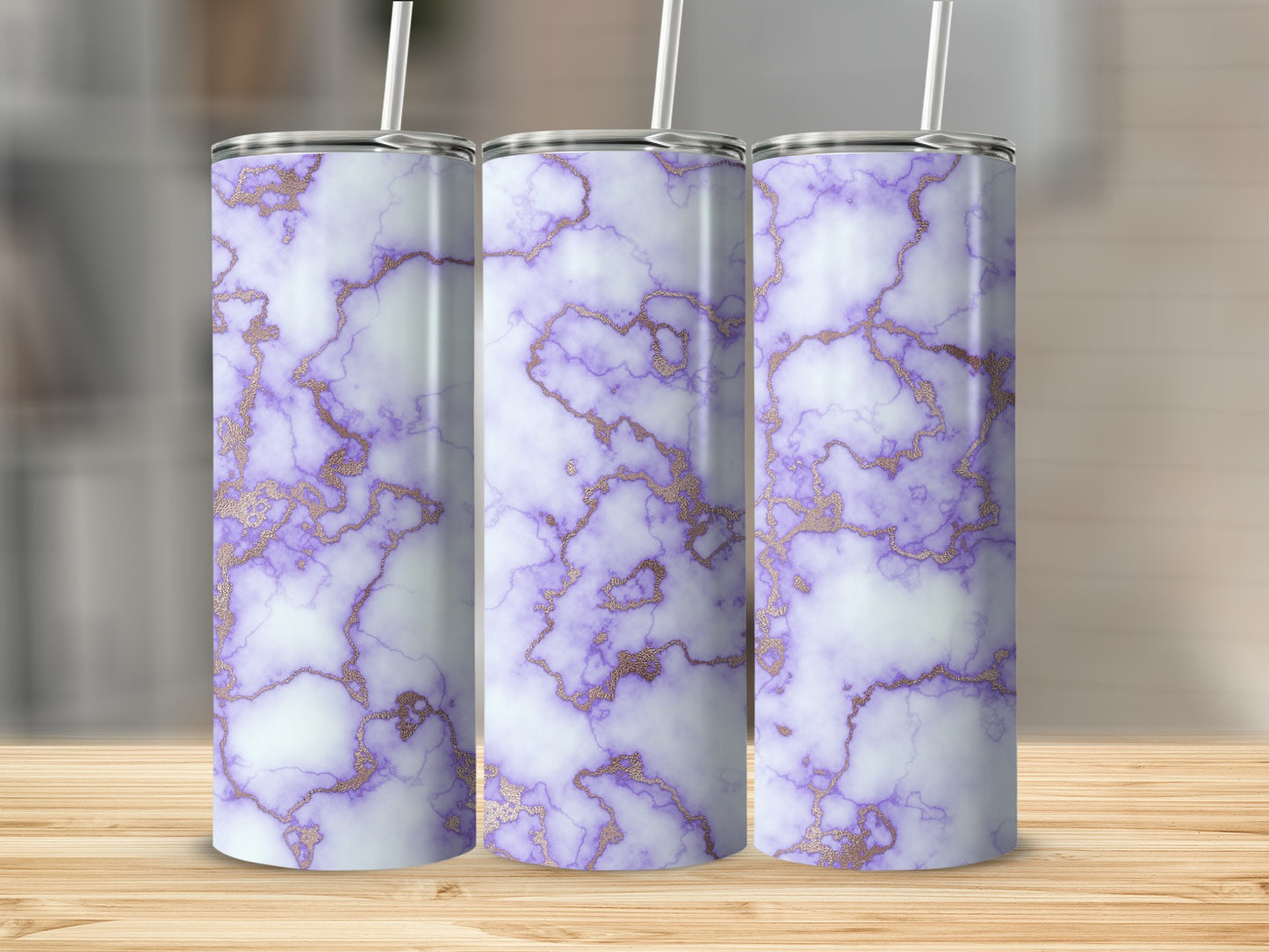Three tumblers with purple and white marble patterns and gold accents.