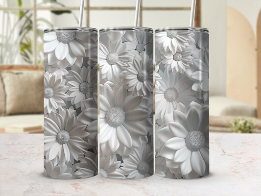 Three silver tumblers with textured white daisy patterns.