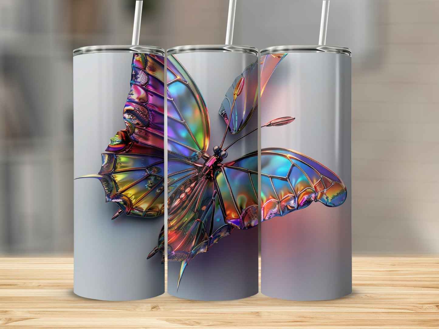 Three tumblers featuring a colorful, iridescent butterfly design with straws.