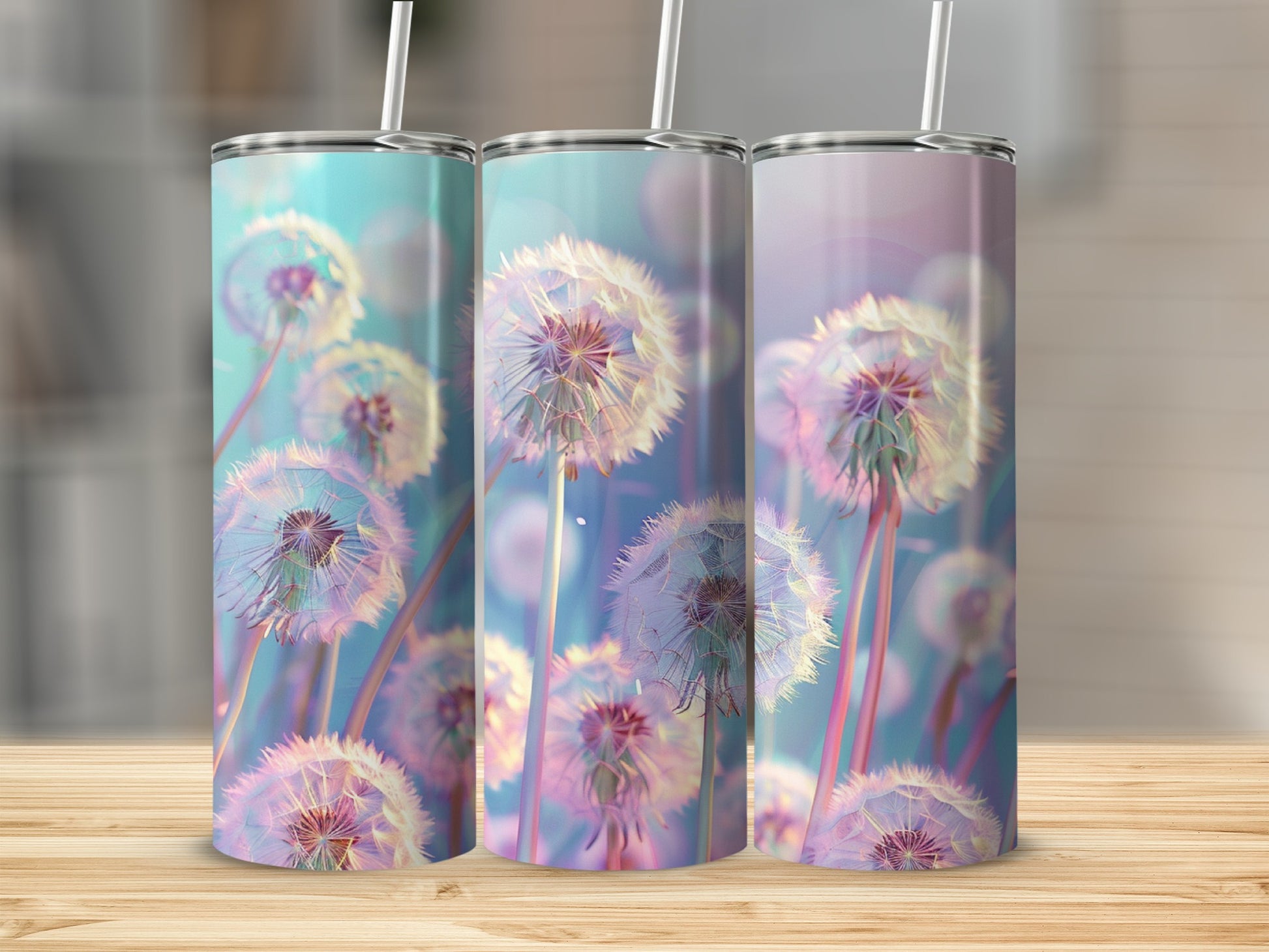 Three tumblers with a dandelion seed head design in pastel colors.