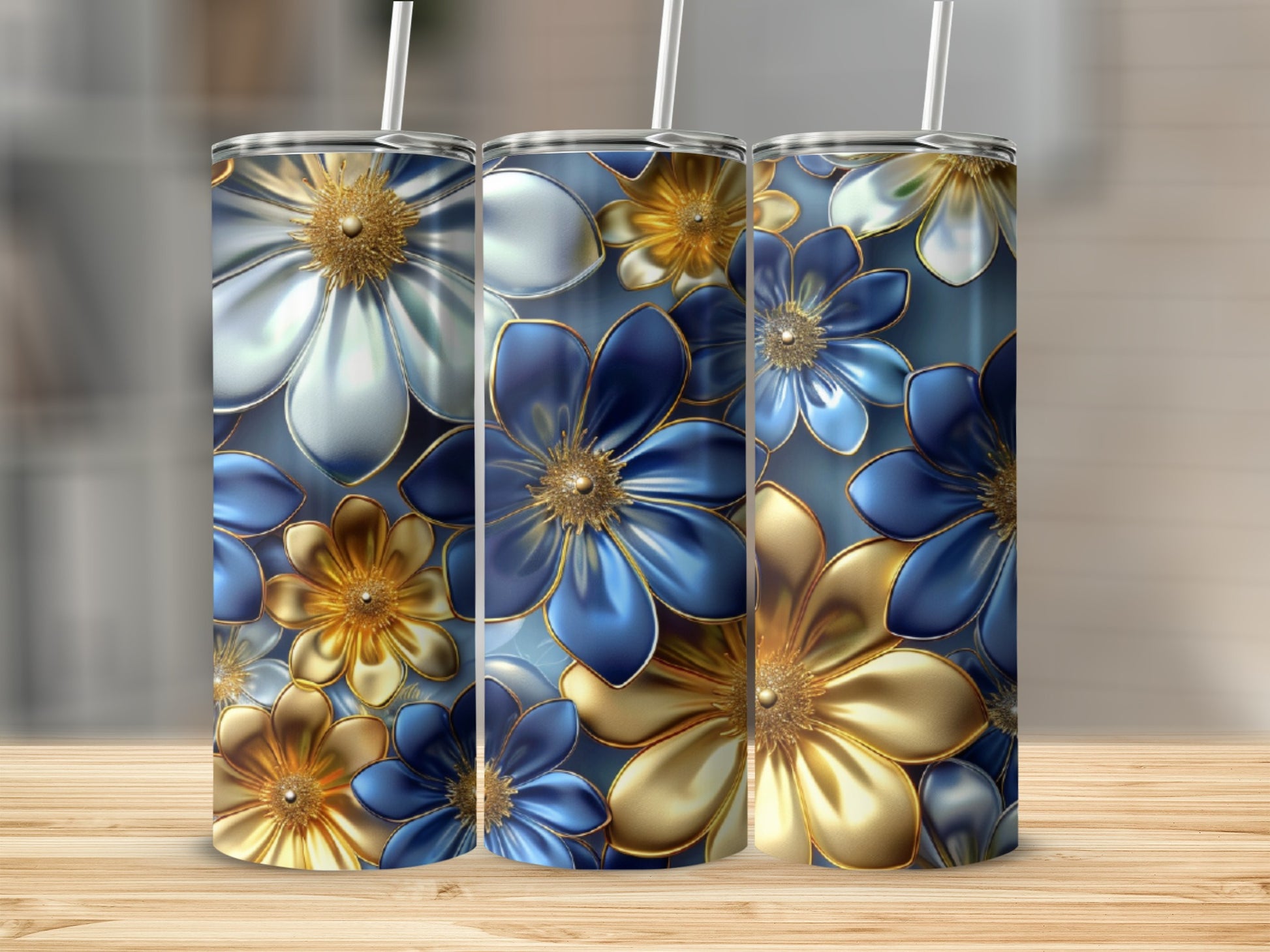 Three tall tumblers with metallic blue and gold floral patterns.