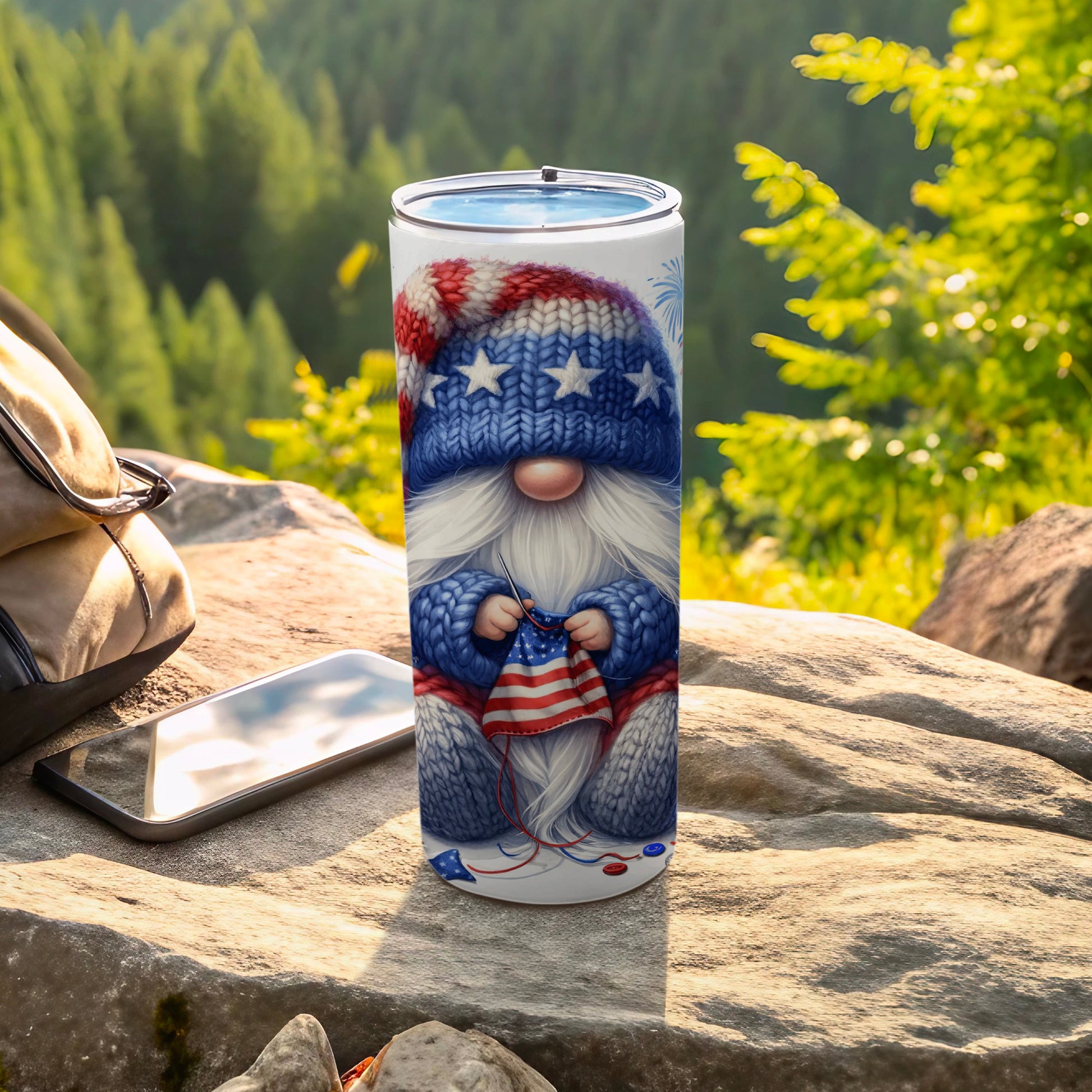 Gnome wearing patriotic scarf knitted on white tumbler with mountain background.