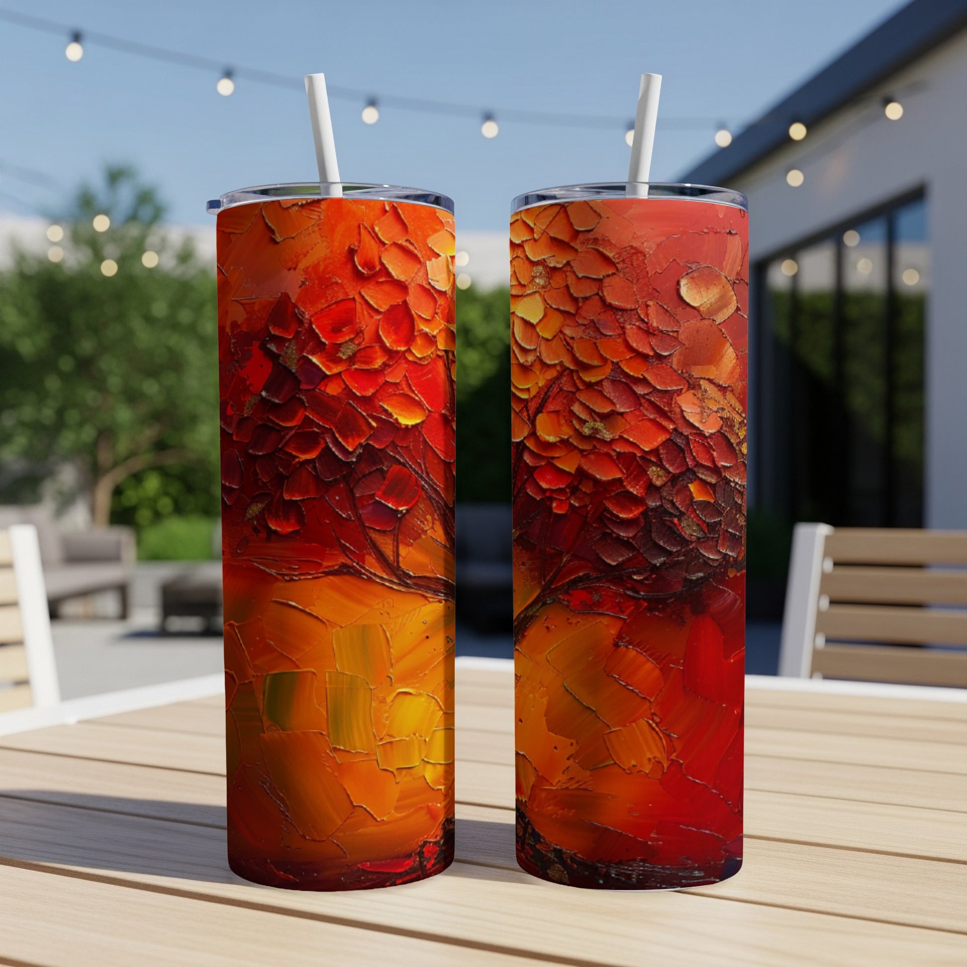 Two tumblers with a textured, abstract fiery red and orange design.