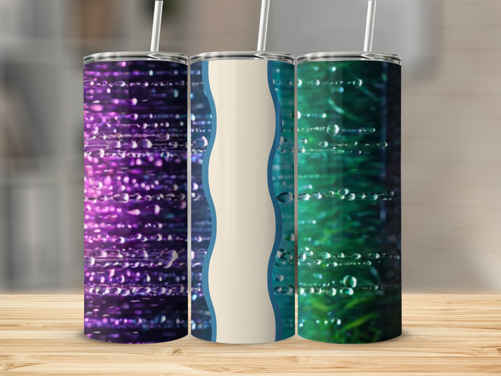 Three tumblers with water droplet designs and a neutral beige stripe.
