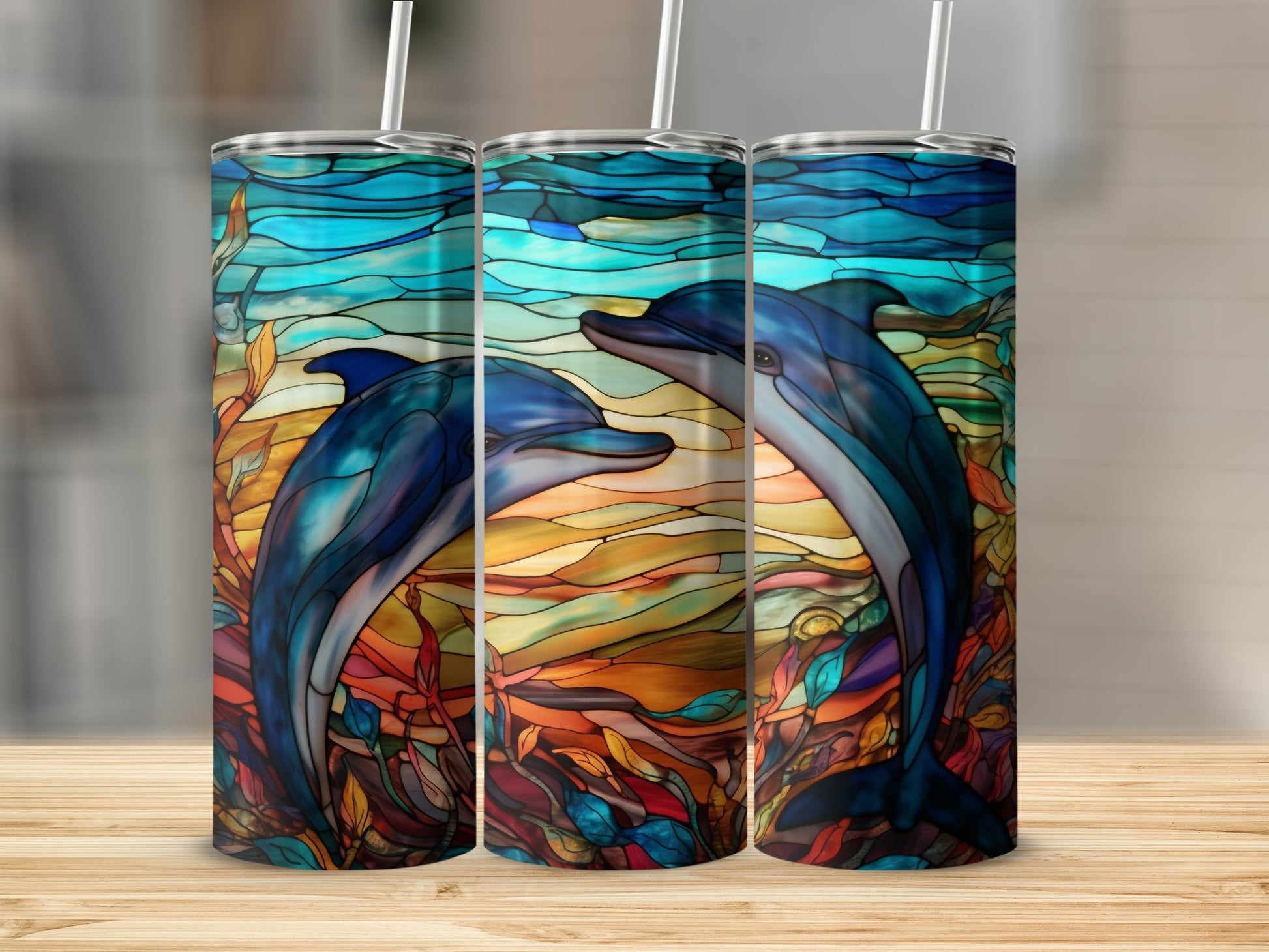Triptych of stained glass tumblers featuring two dolphins swimming amidst colorful aquatic plants.