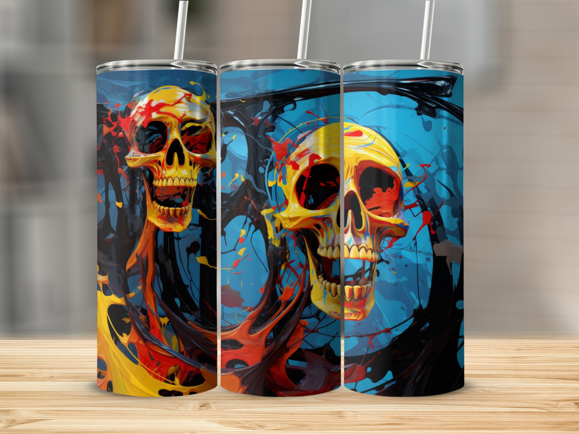 Three tumblers with a colorful abstract skull design and black paint splatters.