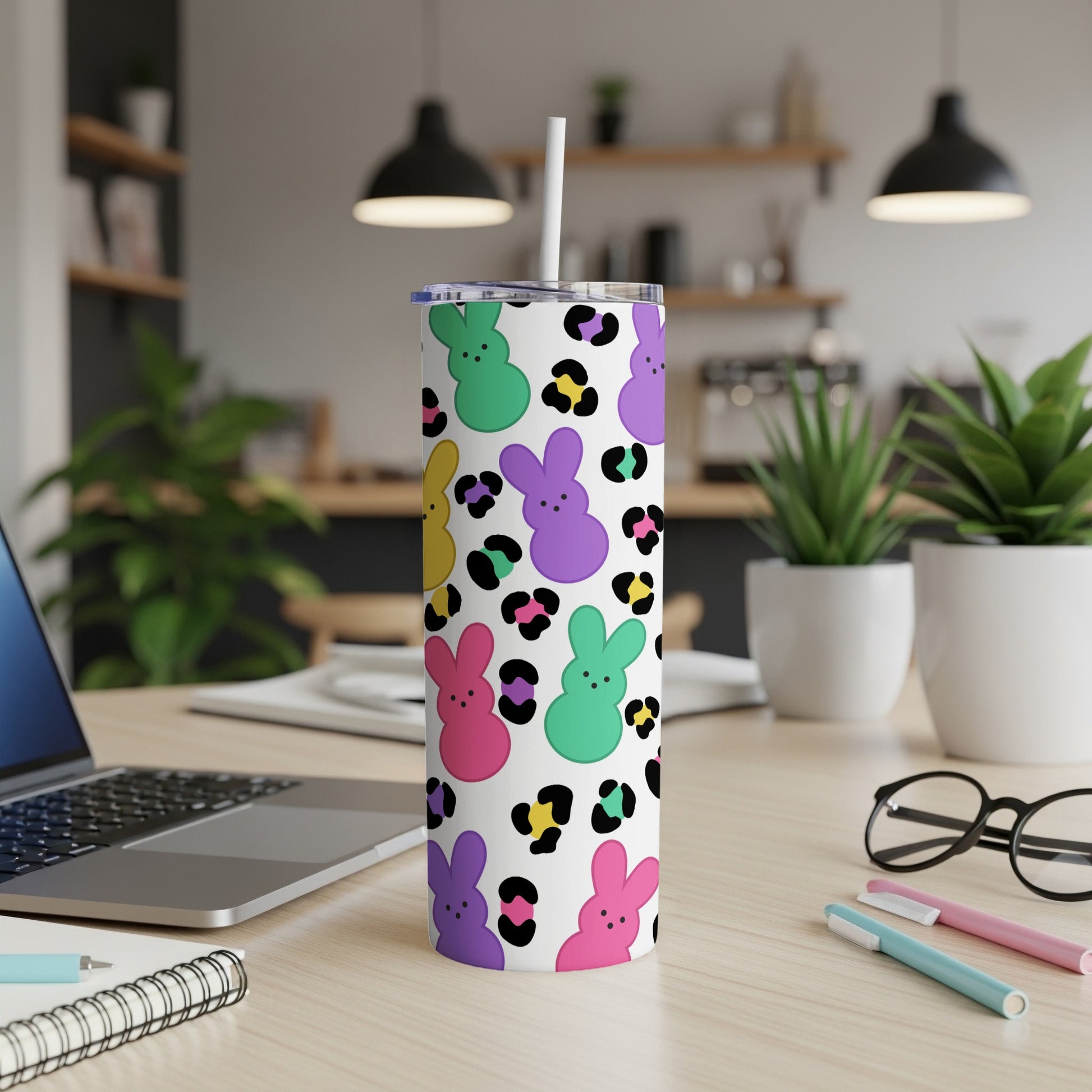 White tumbler with colorful bunny and leopard print design.