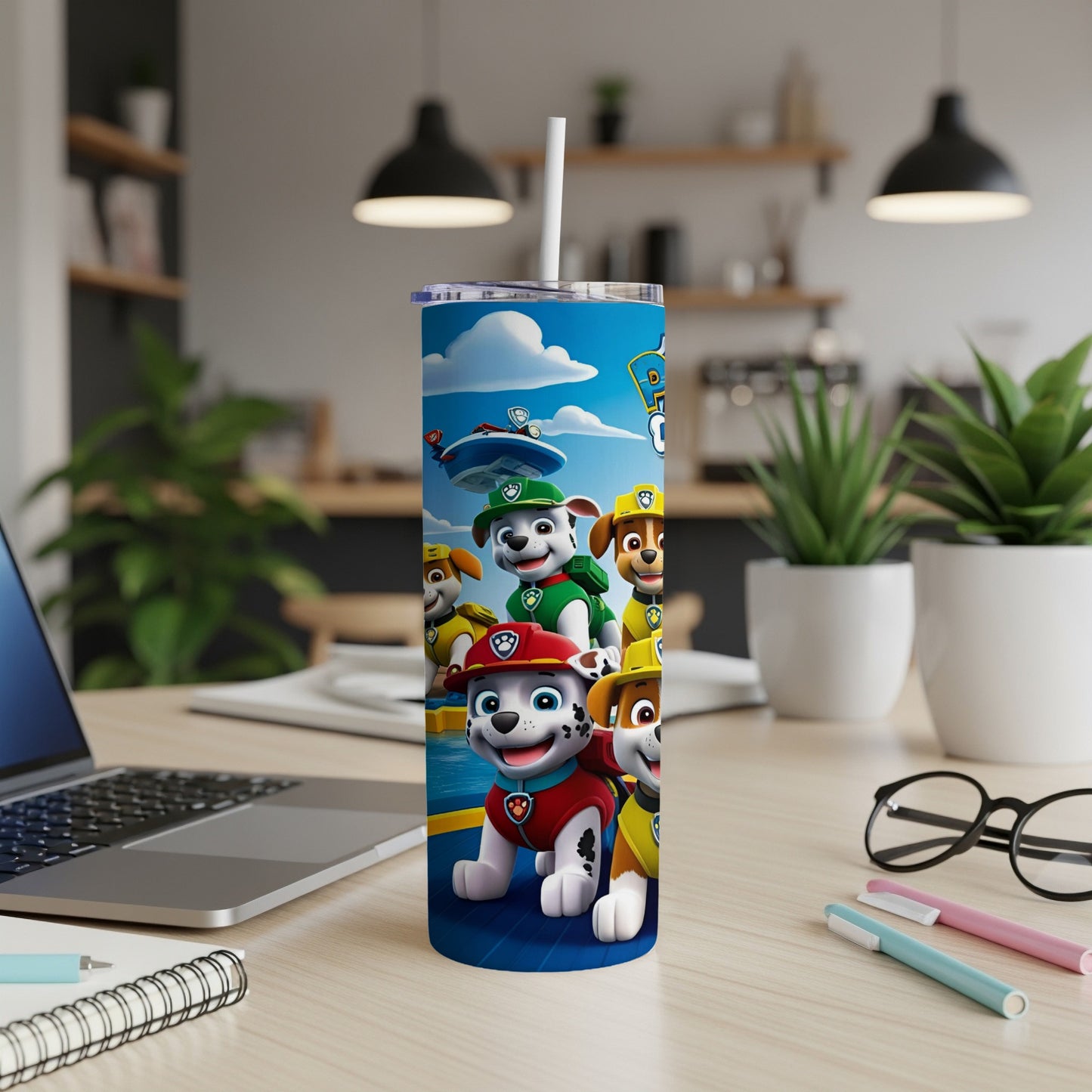 Paw Patrol pups Chase, Marshall, Rubble, and Skye on a blue tumbler.