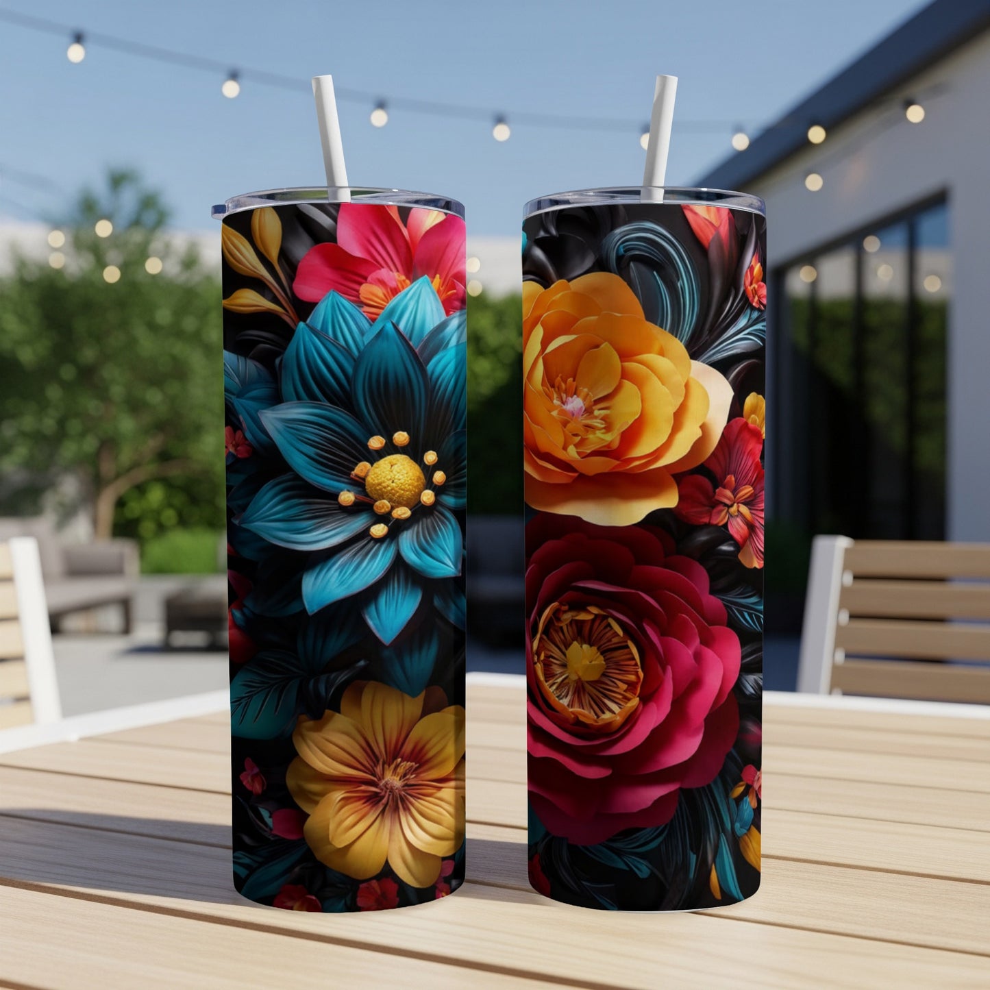 Two tumblers with vibrant floral designs featuring teal, red, and yellow blooms.