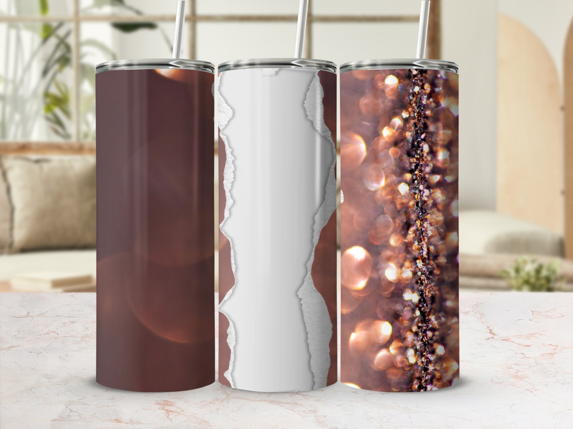 Three tumblers on a marble surface, with glitter and torn paper designs.
