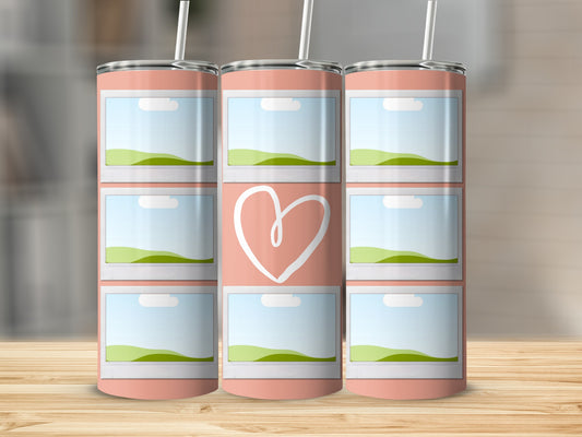Pink tumbler with stacked photo frames and a white heart design.