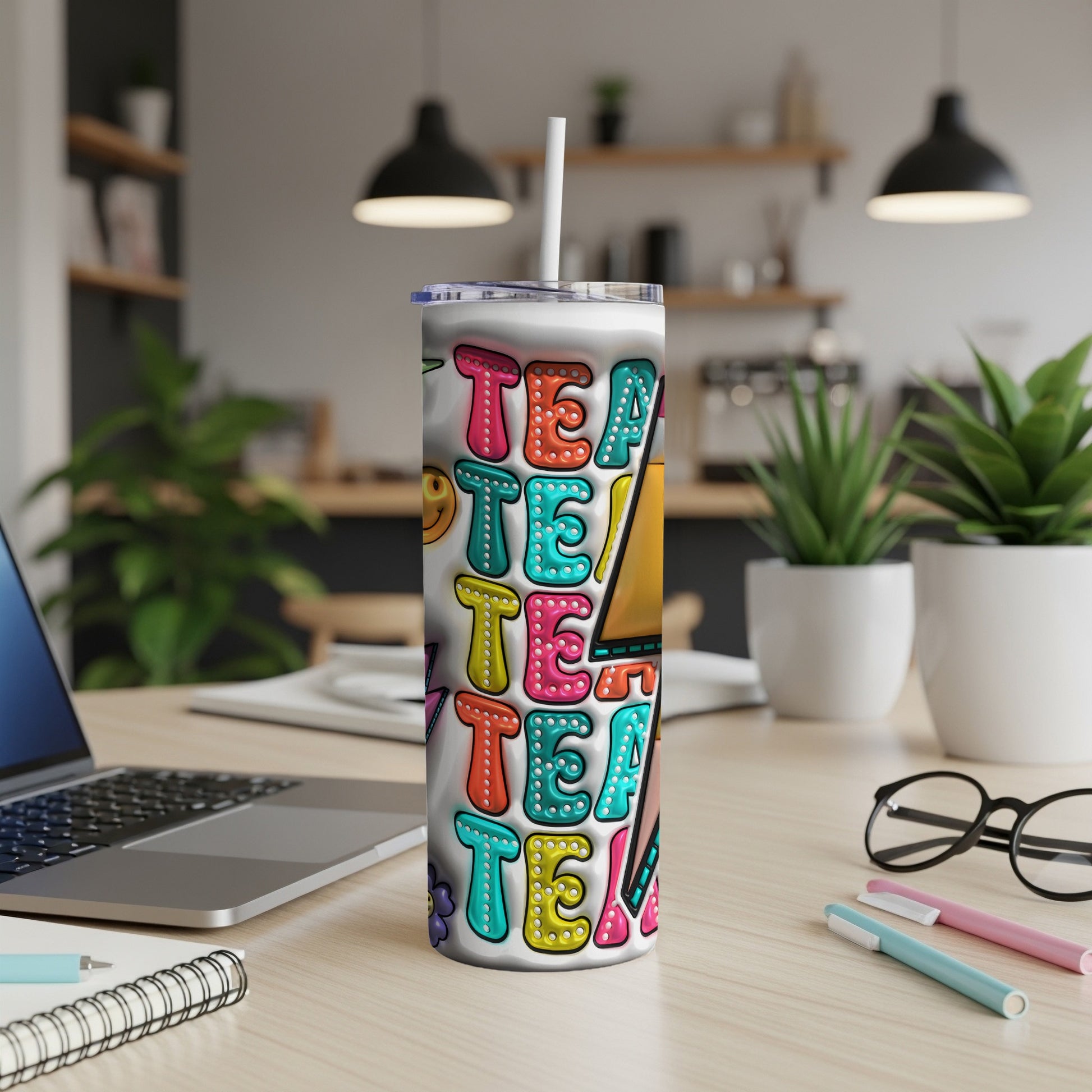 White tumbler with colorful "Teacher" text and smiley faces.