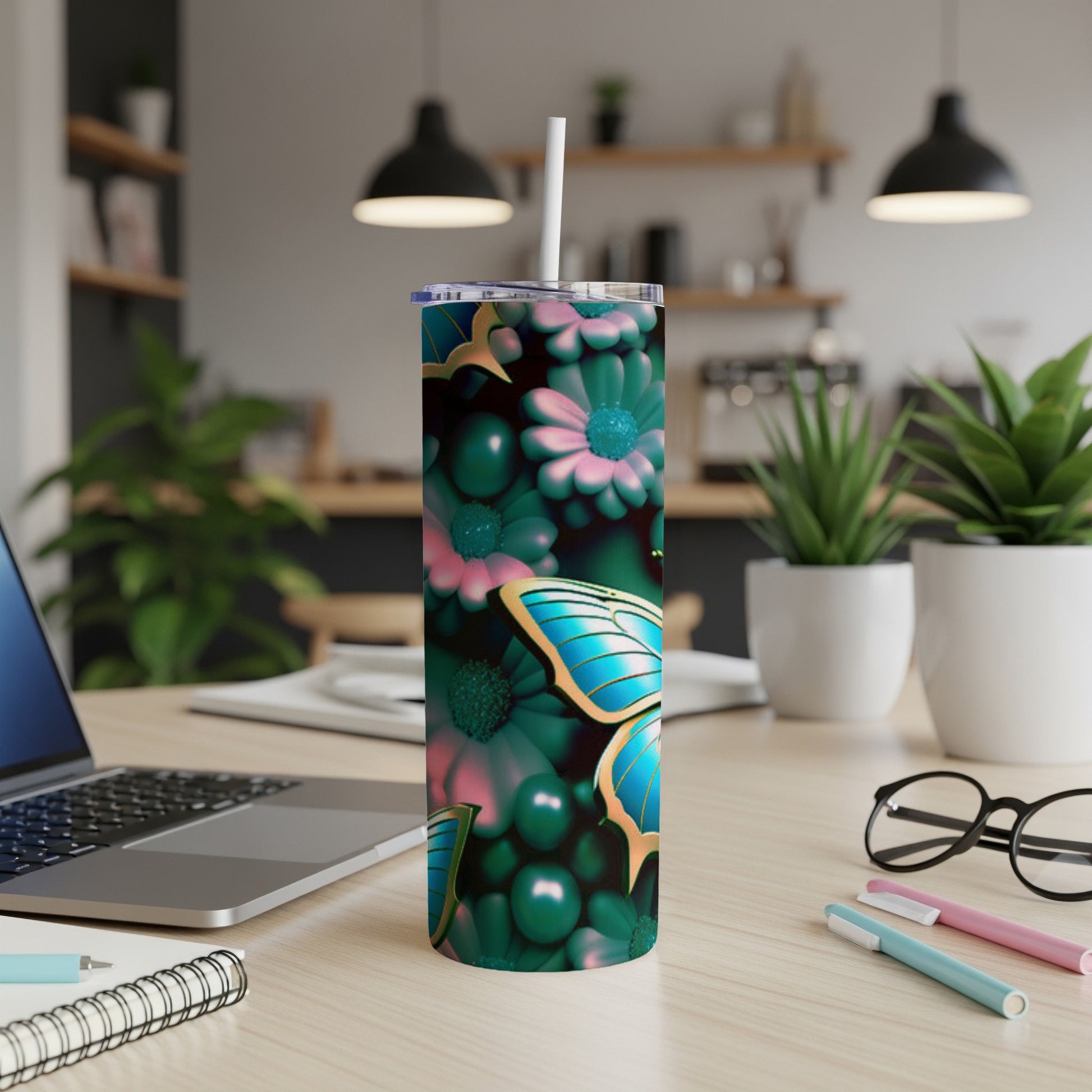 Tumbler with blue butterfly and teal floral pattern.