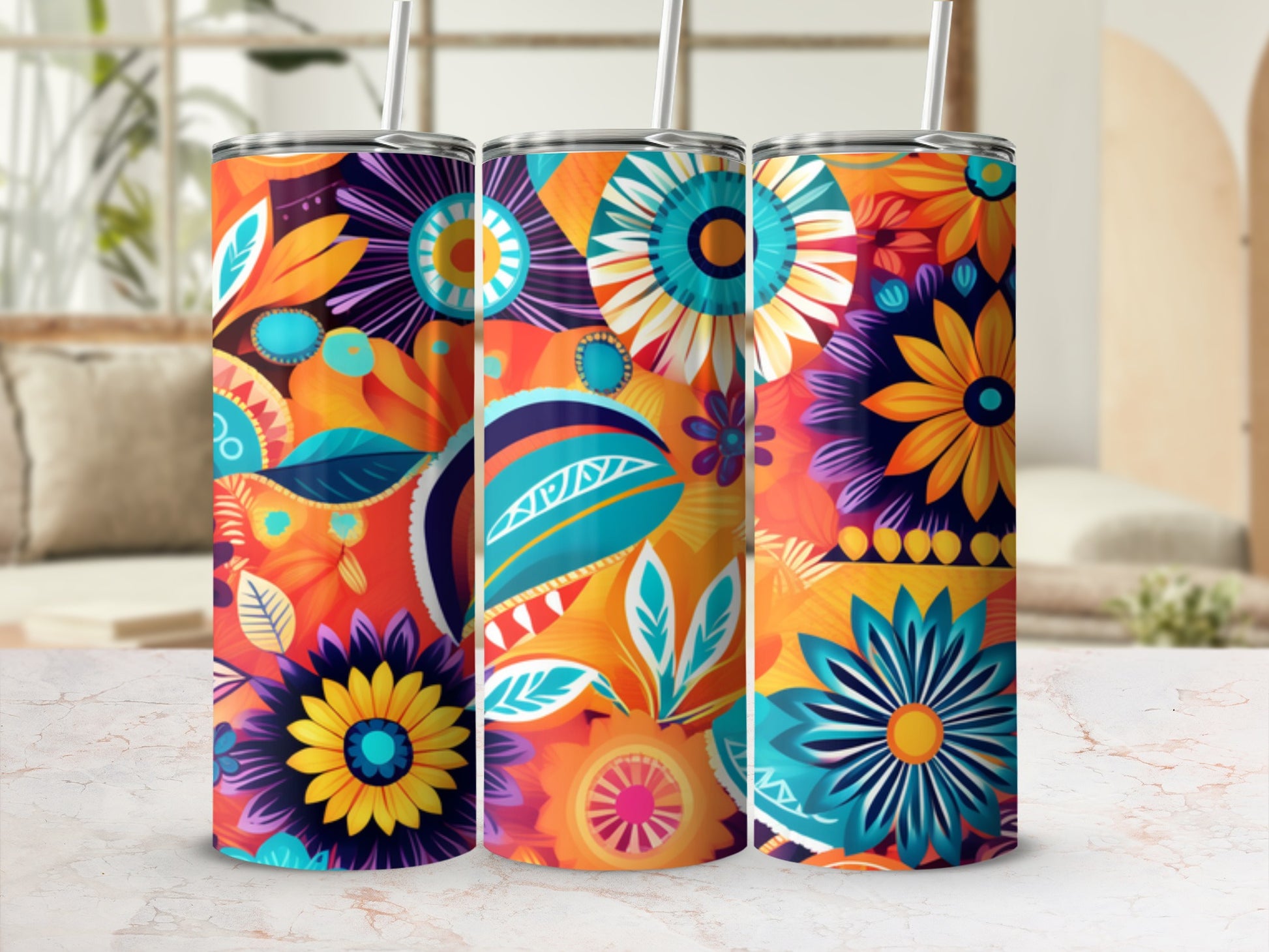 Three tumblers with vibrant floral and leaf patterns in orange, blue, and purple.