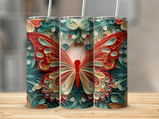 Three tumblers with a detailed red and orange butterfly design on a wooden surface.