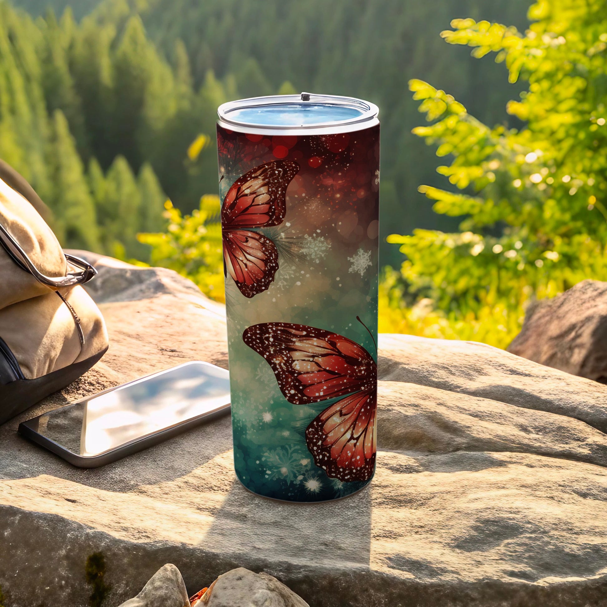 Tumbler with red butterflies, snowflakes, and glittery background.