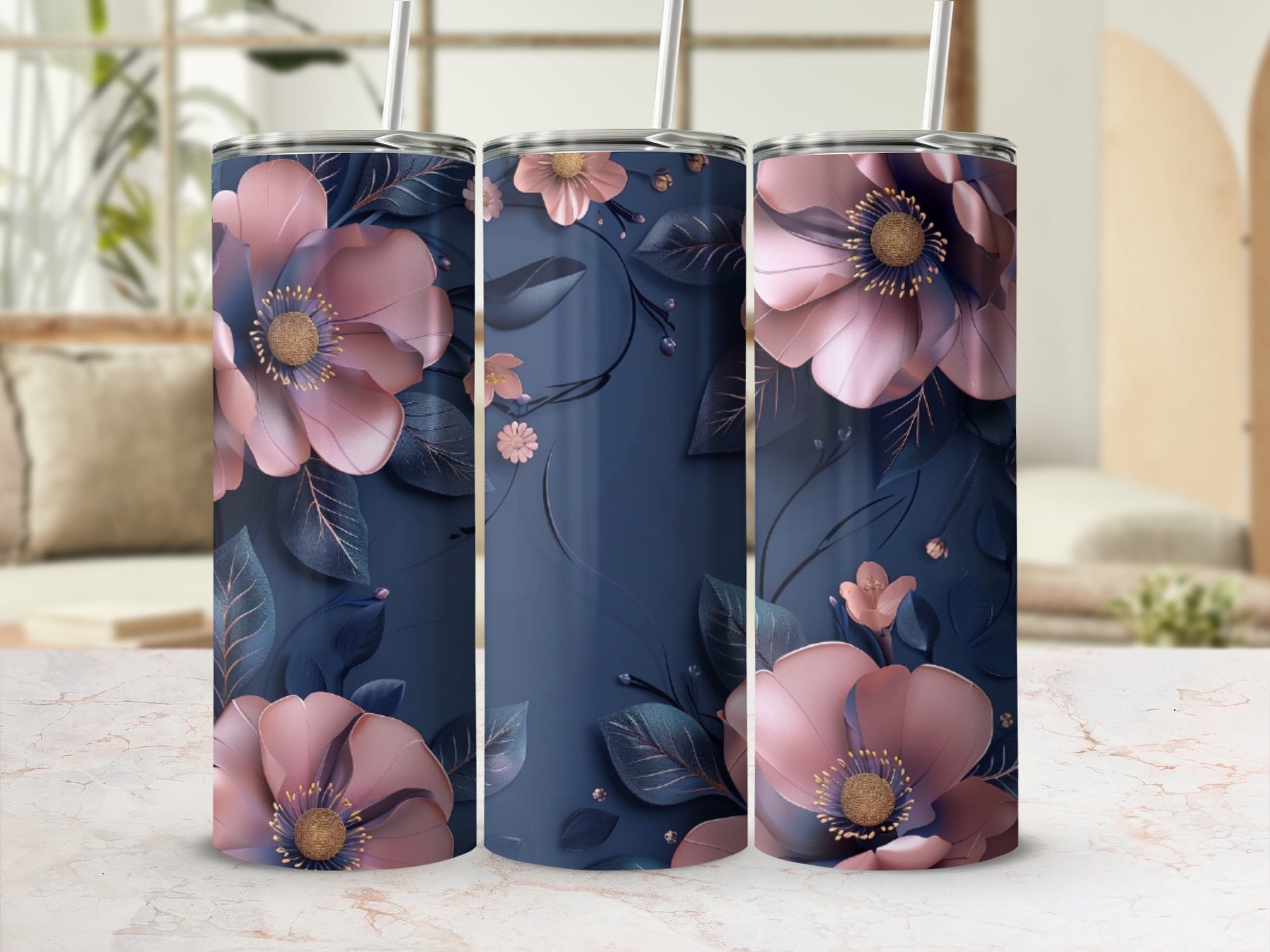 Three navy tumblers adorned with large pink floral designs and delicate leaves.