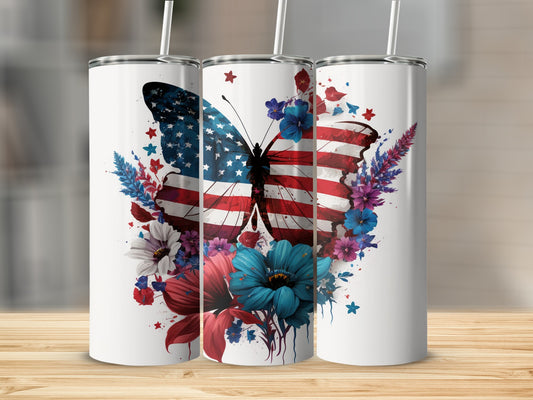 Butterfly with American flag wings and floral accents on a white tumbler.