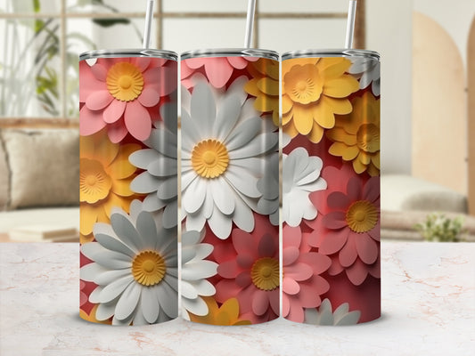 Floral pattern tumbler with straws in shades of pink, white, and yellow.
