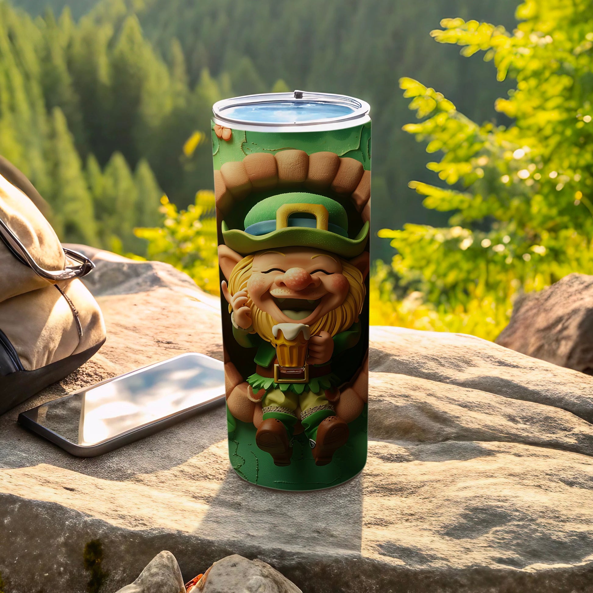 Leprechaun holding a beer mug on a green tumbler with mountains in background.