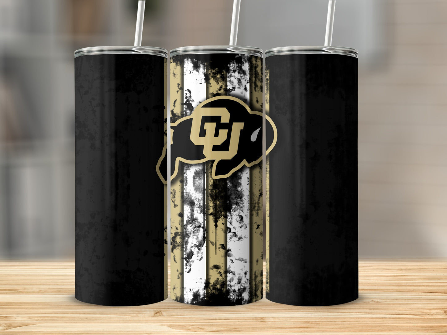 Three tumblers with a distressed black and gold stripe design and CU buffalo logo.