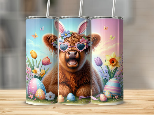 Highland cow with Easter eggs and flowers on a tumbler.