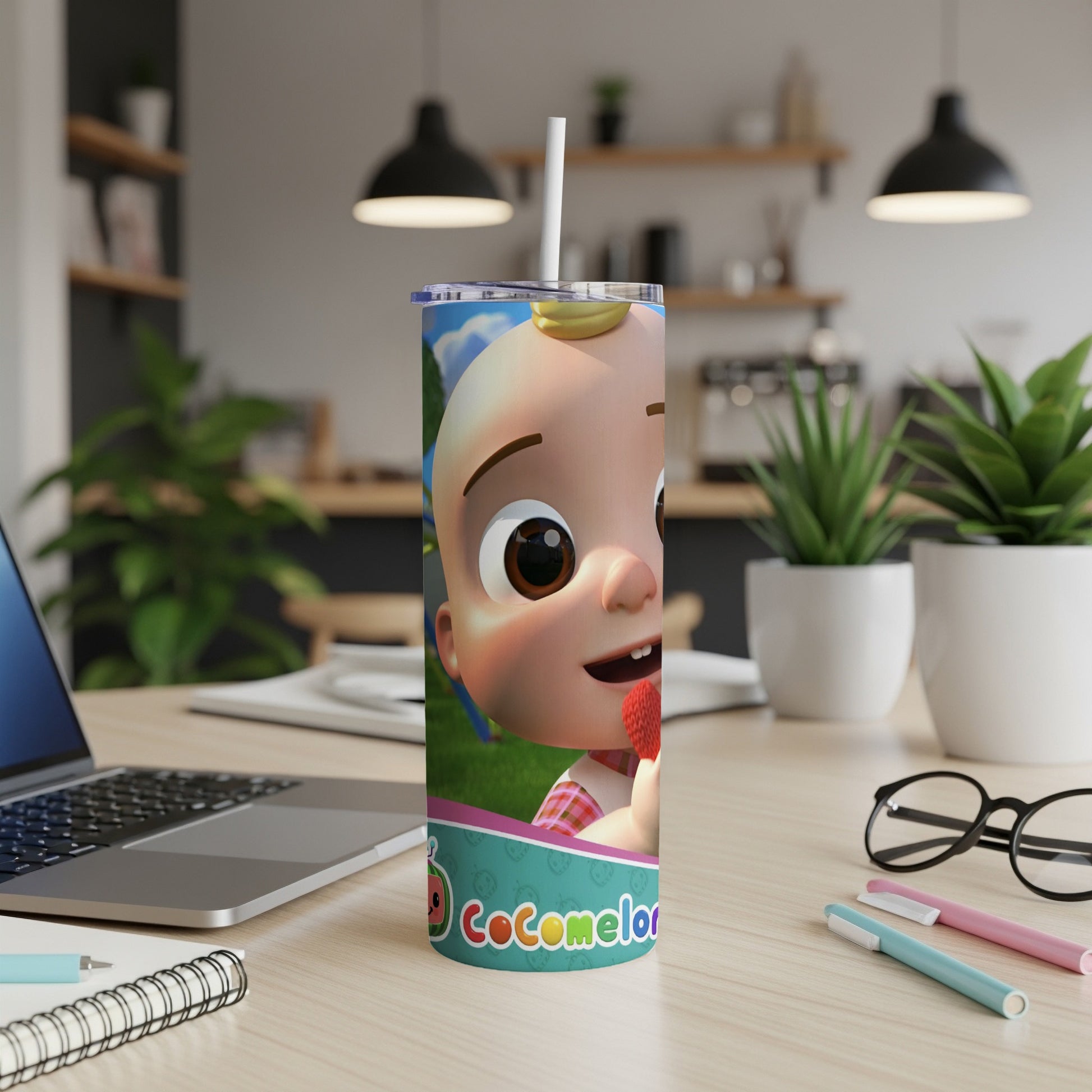 Cocomelon character on a skinny tumbler with a straw.
