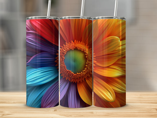 Three colorful flower designs on tumblers, featuring vibrant petals and textured centers.