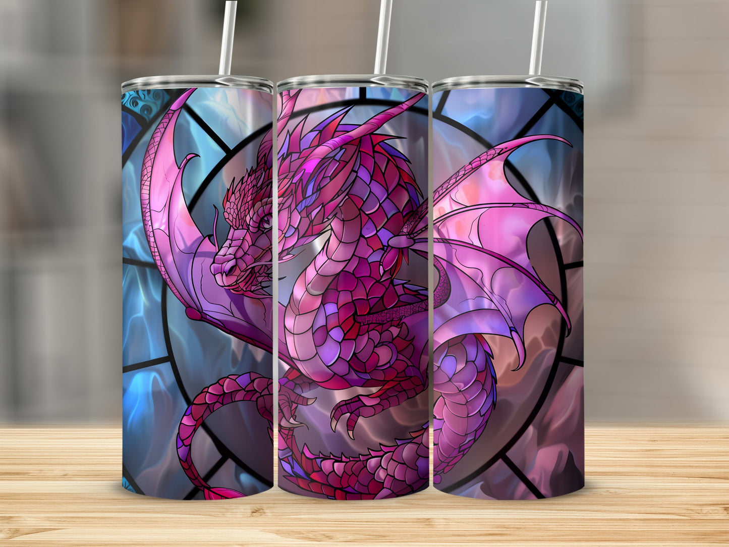 Three pink dragon tumblers with stained glass backgrounds on a wooden surface.