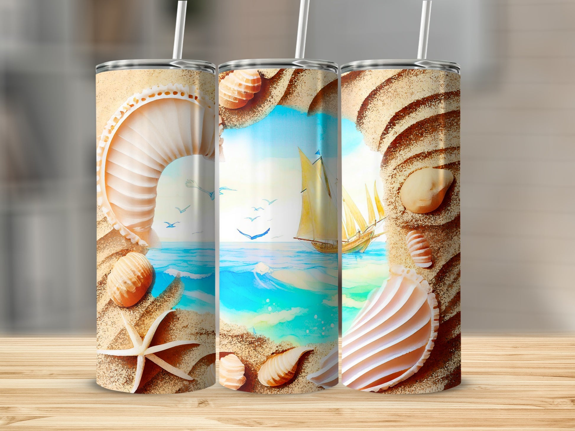 Beach scene with seashells and sailboat on three tumblers.