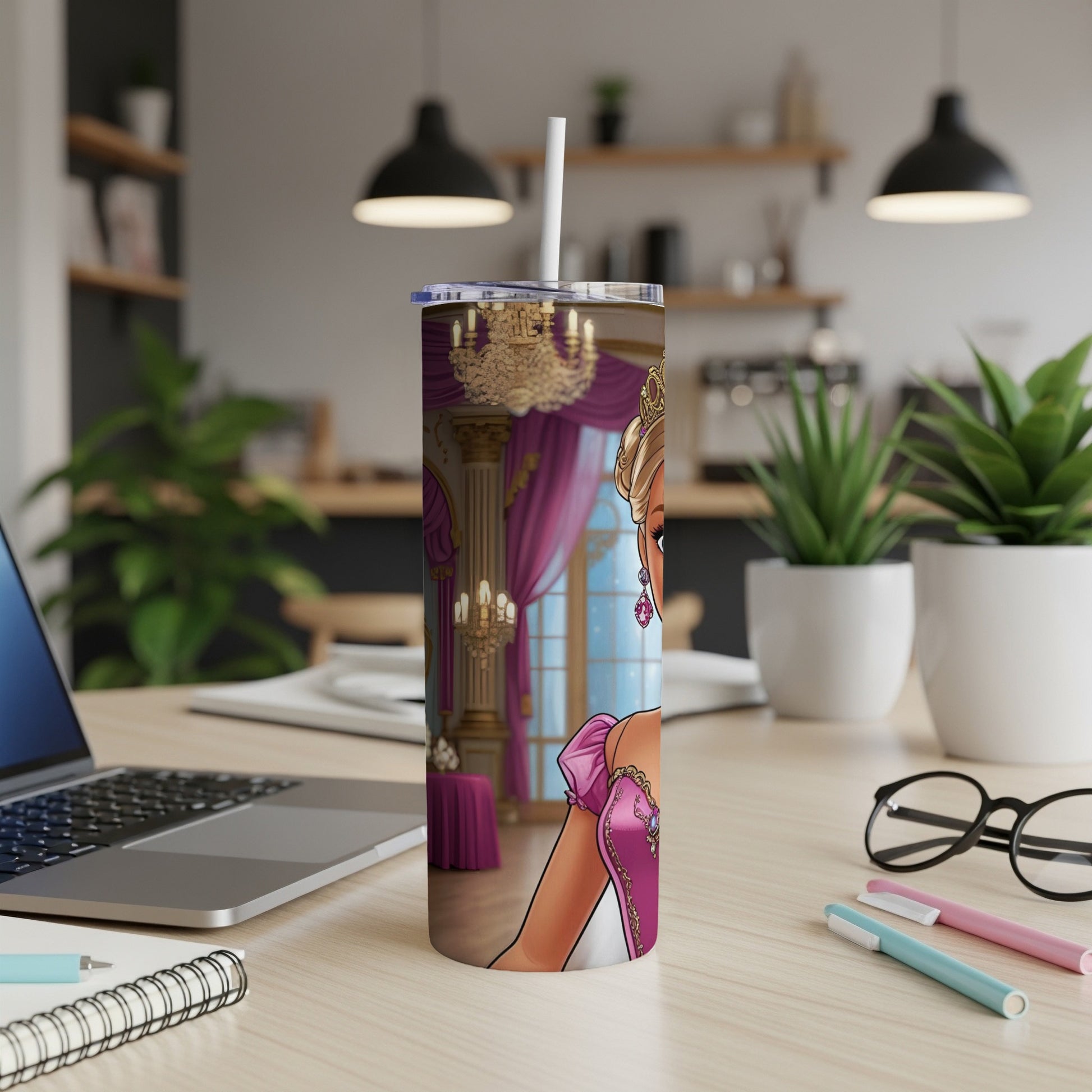 Cartoon princess on a pink and gold tumbler with straw, on a desk.