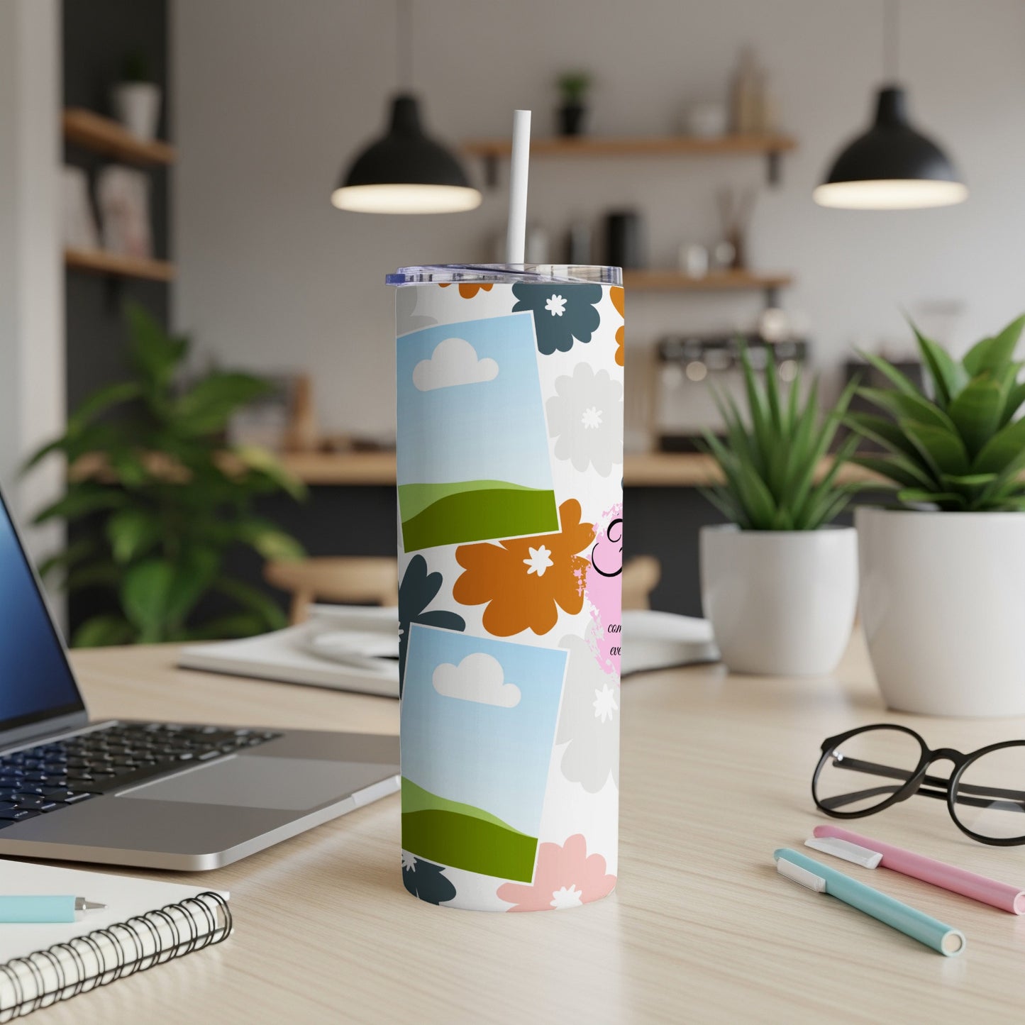 Tumbler with floral pattern, clouds, landscape photos, and text.