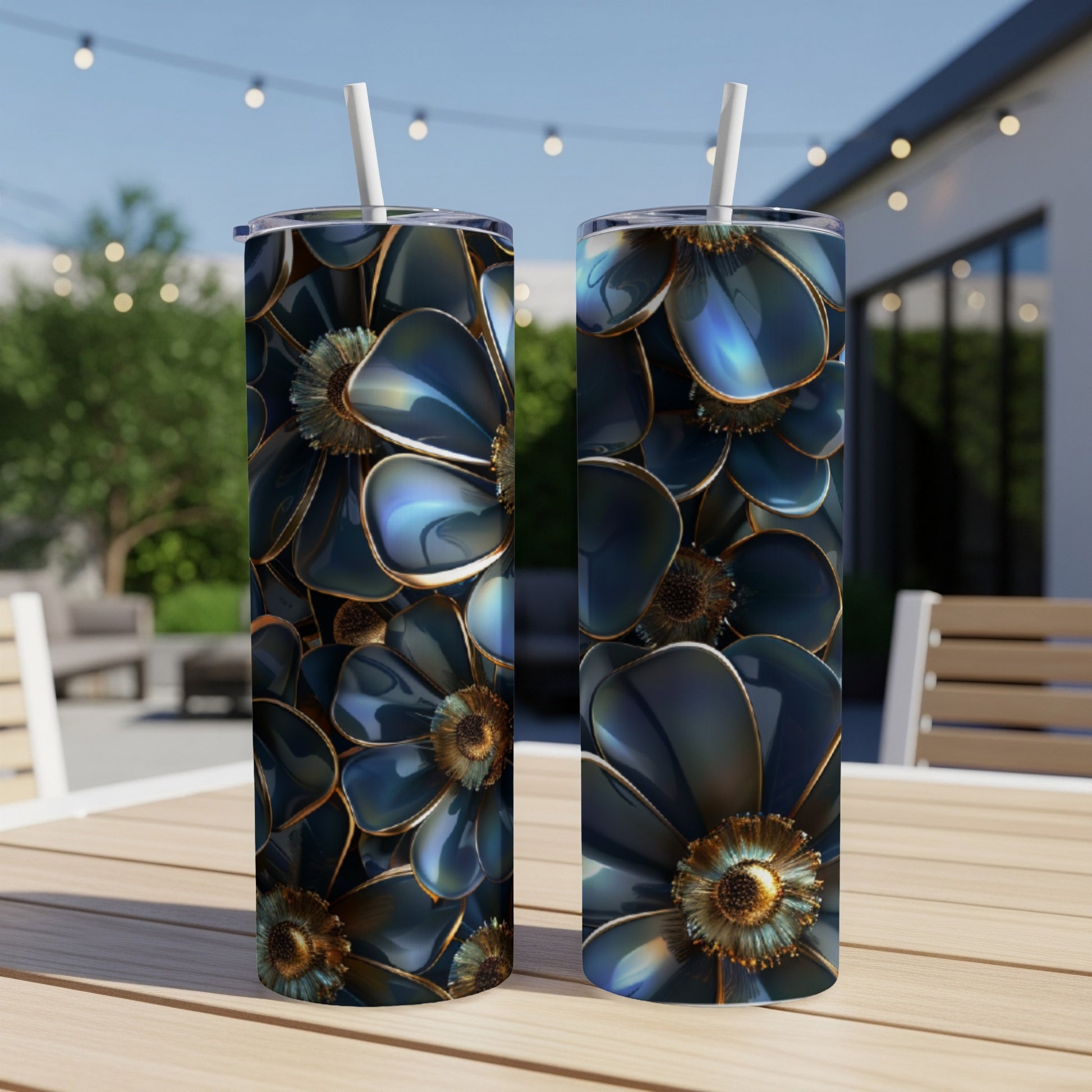 Two tumblers with a dark blue floral pattern sit on a wooden table.