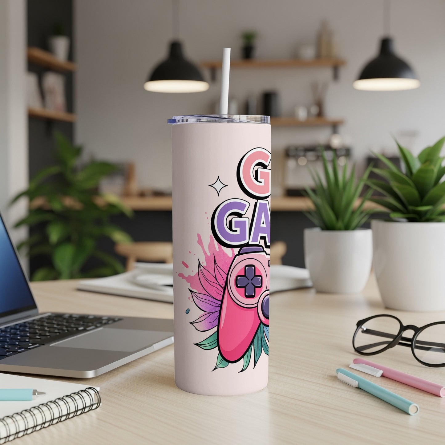 Pink tumbler with "Gamer" text and a purple joystick illustration.