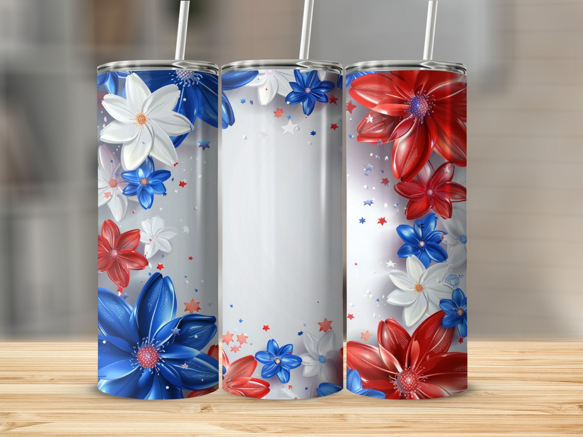 Three tumblers with red, white, and blue floral designs, standing on a wooden surface.