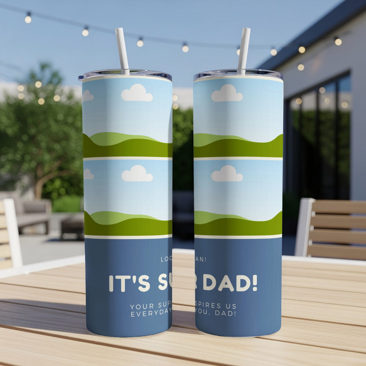 Blue tumblers with sky and hill graphics, "IT'S SUPER DAD!" and supportive text.