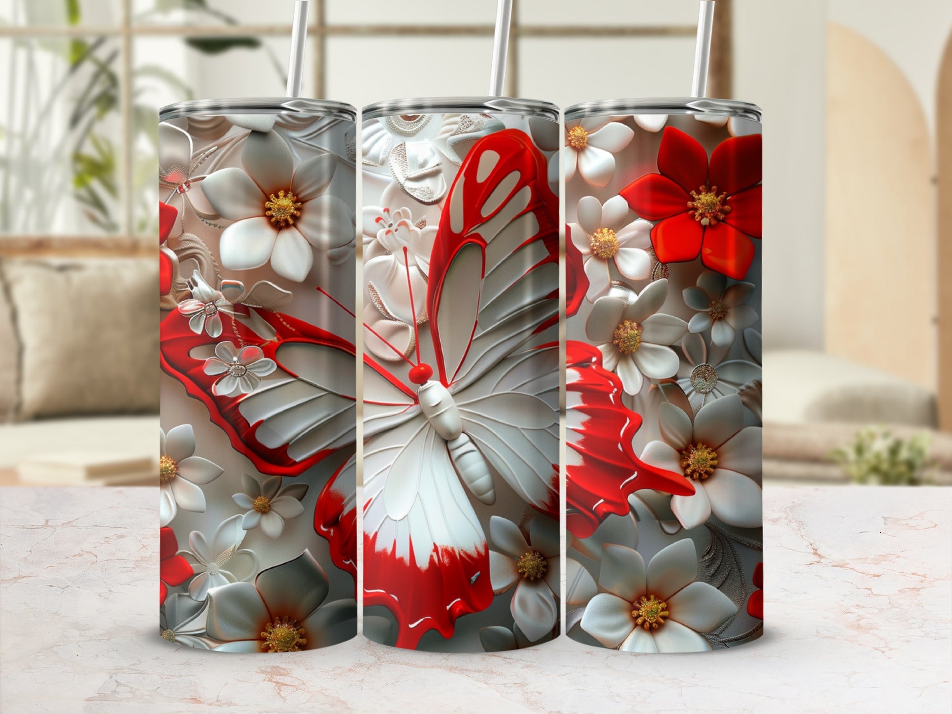 Silver tumbler with red and white butterfly and floral design.