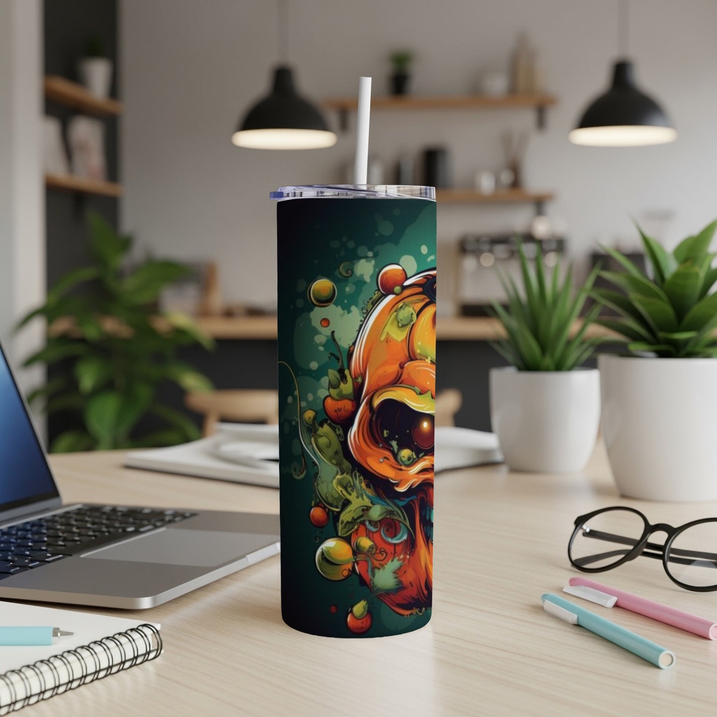 Tall tumbler with a vibrant, spooky Halloween-themed skull and pumpkin design.