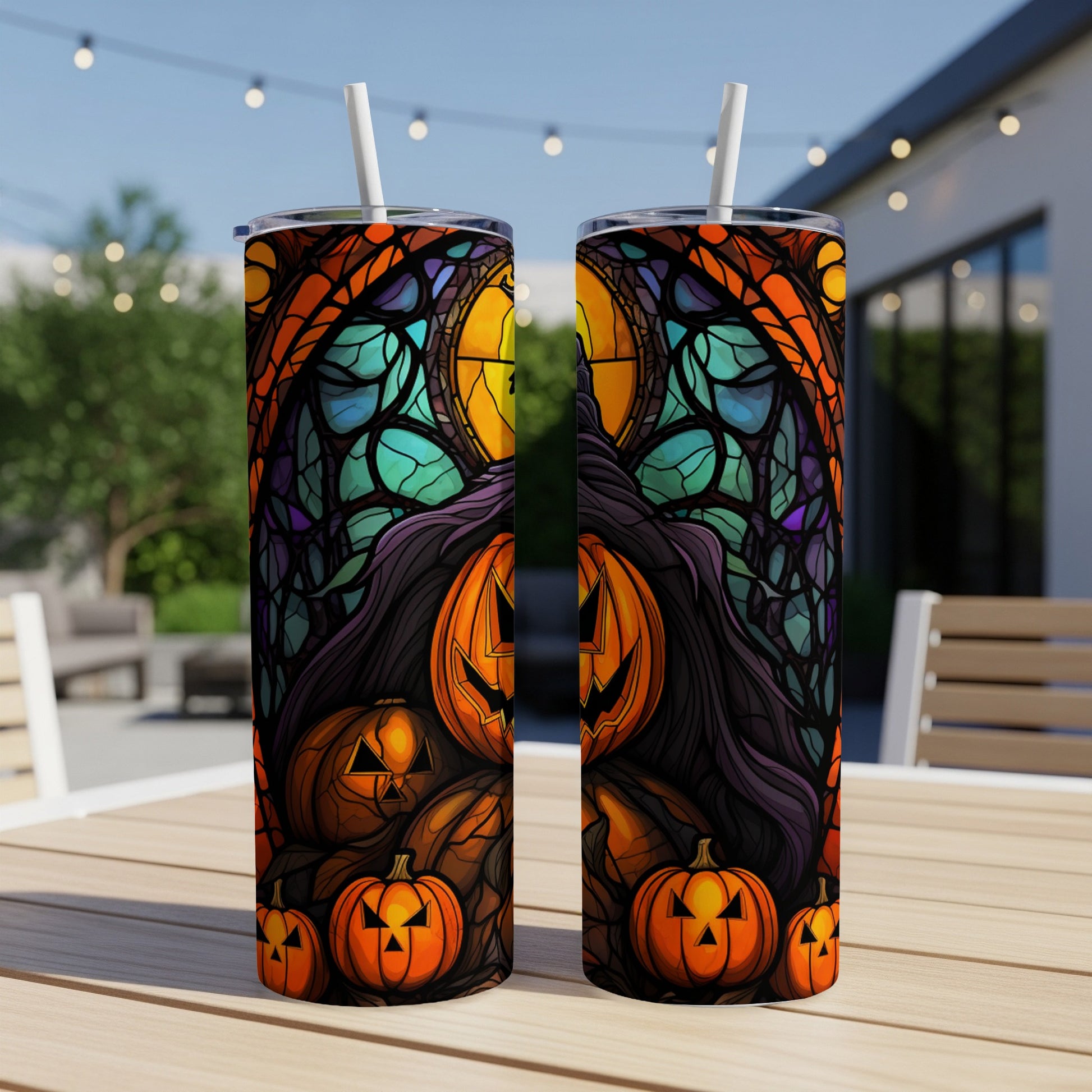 Halloween tumbler with carved pumpkins and stained glass design.