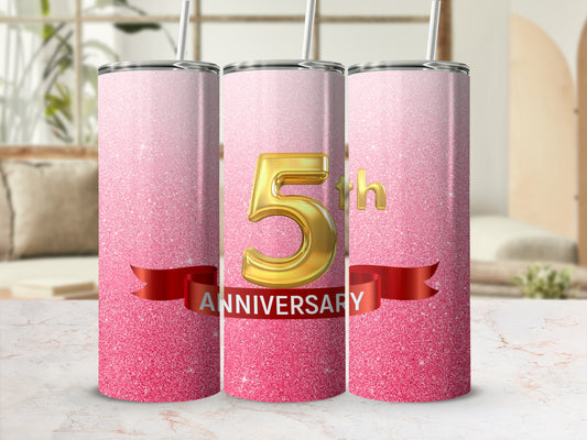 Pink glitter tumbler with "5th ANNIVERSARY" text and gold numbers.