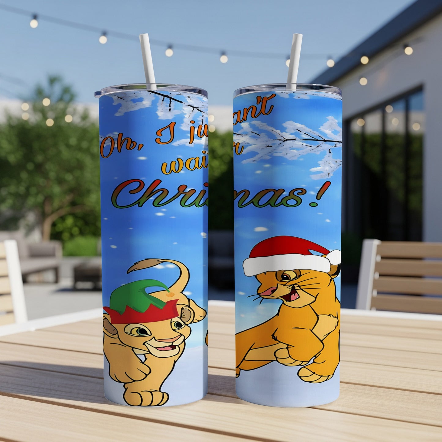 Simba and Nala wearing Santa and elf hats, on a Christmas tumbler.