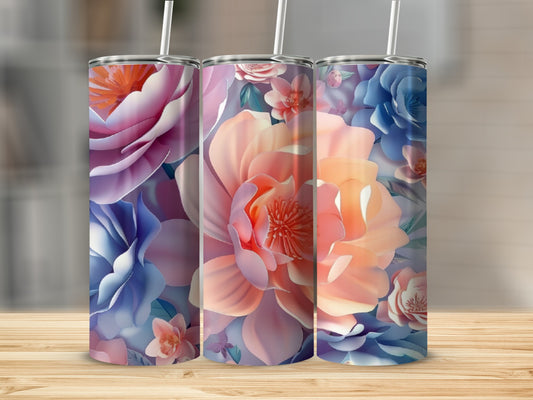 Three tumblers with vibrant floral patterns in pink, blue, and peach hues.