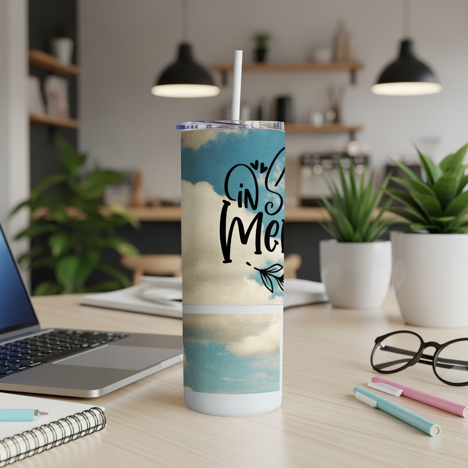 Tall tumbler with sky and cloud pattern and text "In My".
