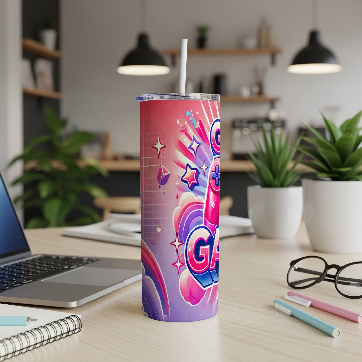 Pink tumbler with "GAME" text and colorful retro gaming graphics.