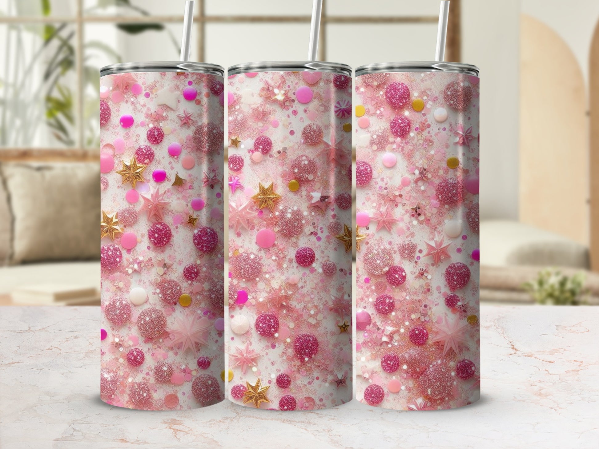 Three tumblers with pink glitter, stars, and confetti patterns.