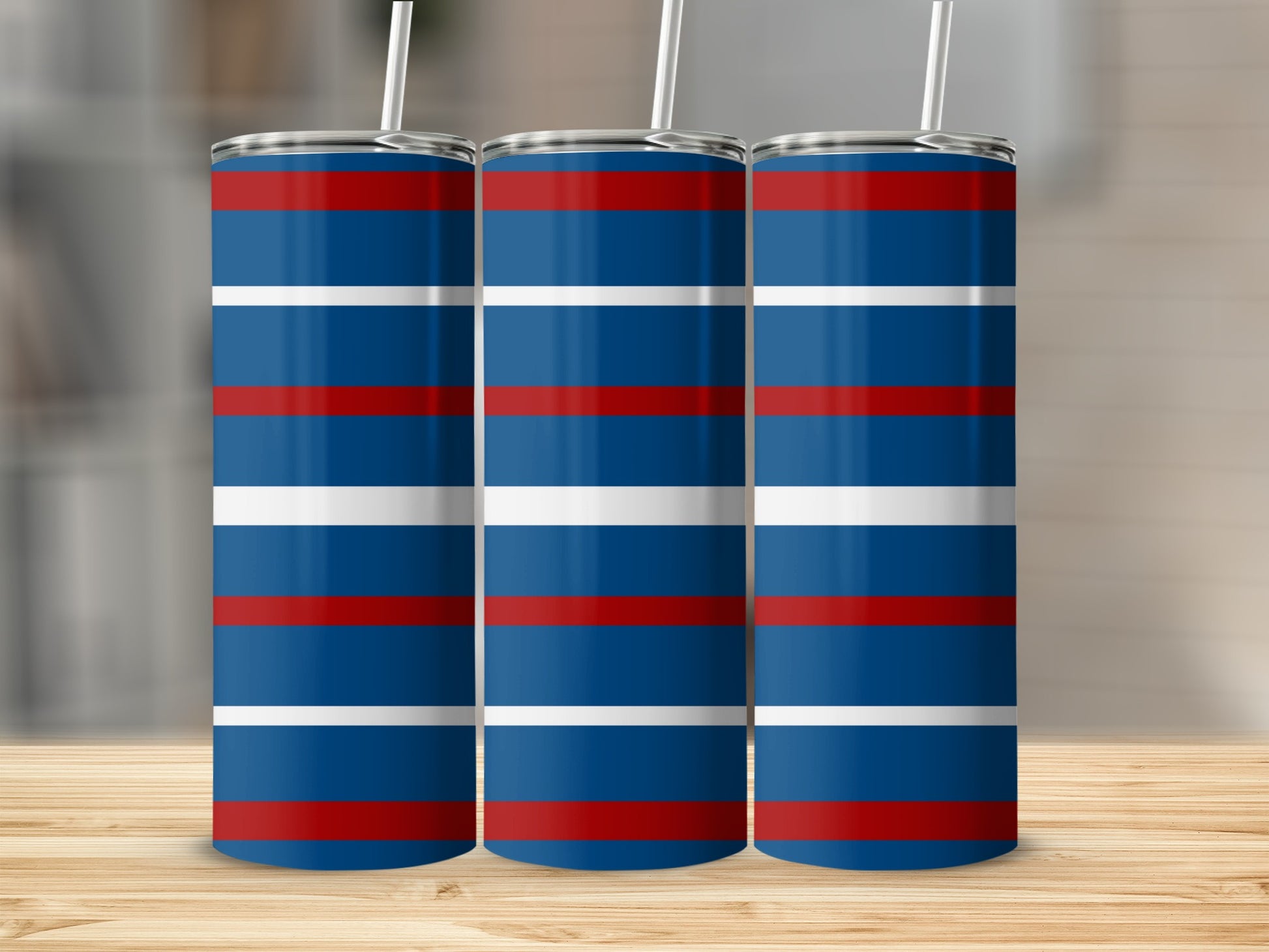 Three tall, slender tumblers with red, white, and blue horizontal stripes.