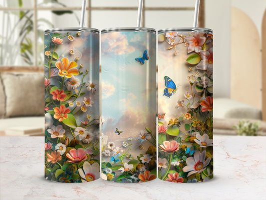 Floral pattern with butterflies on three tumblers with lids and straws.