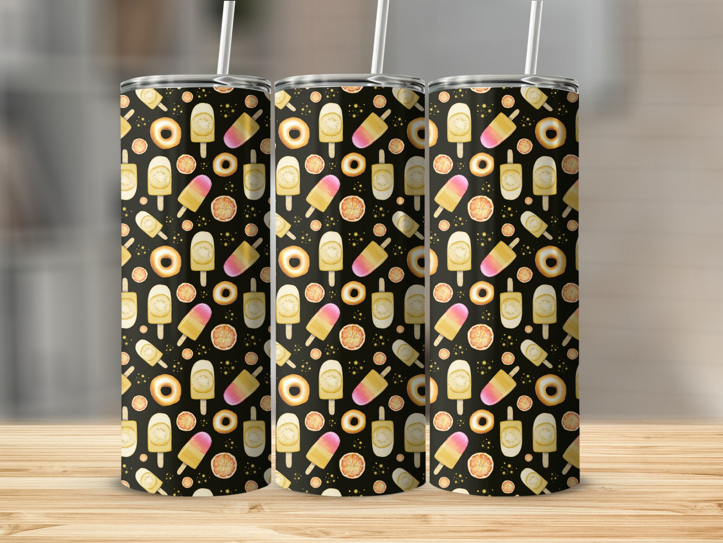 Three tumblers with a pattern of ice pops, donuts, and oranges.
