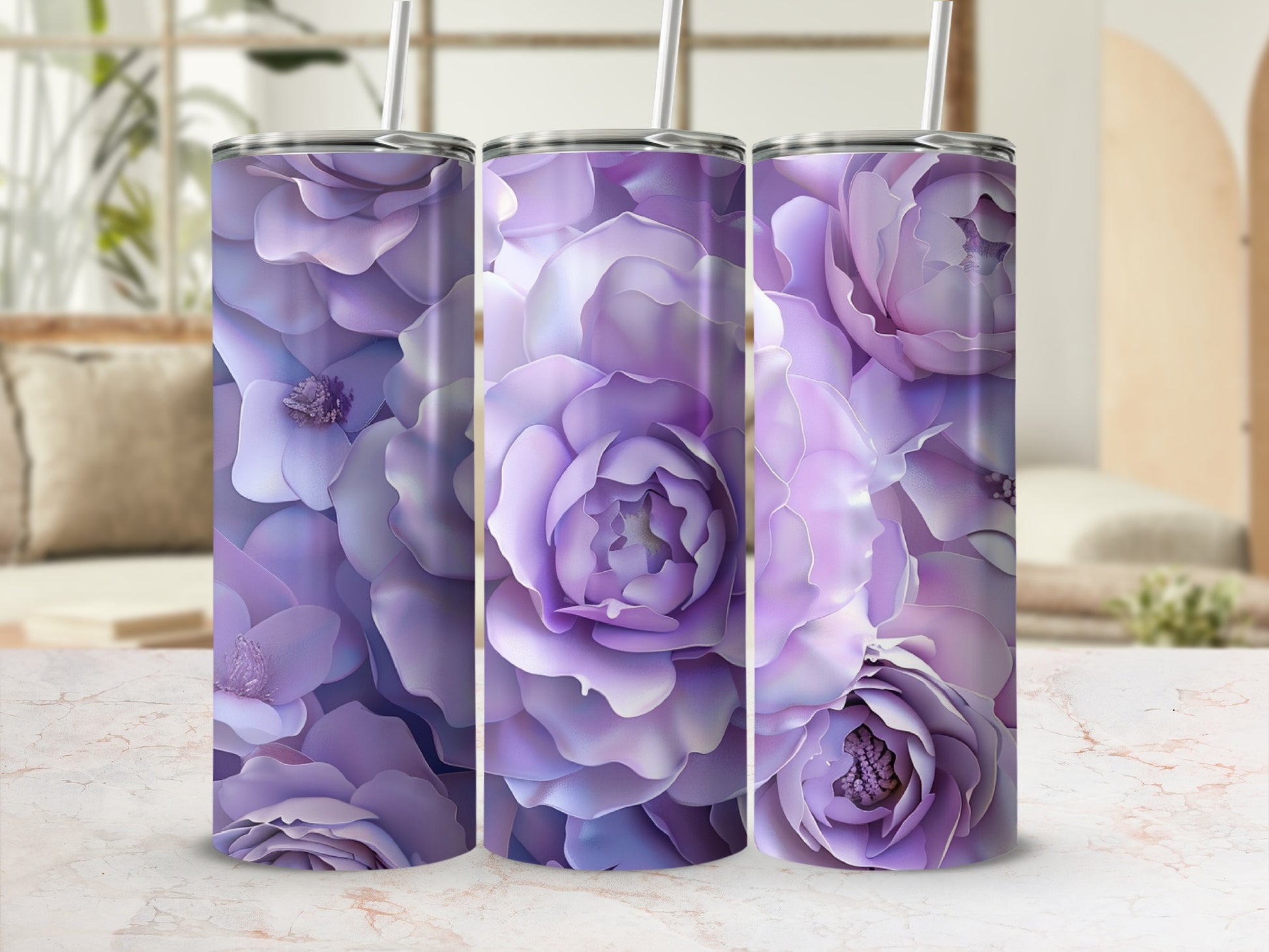 Three purple floral patterned tumblers with straws on a marbled surface.