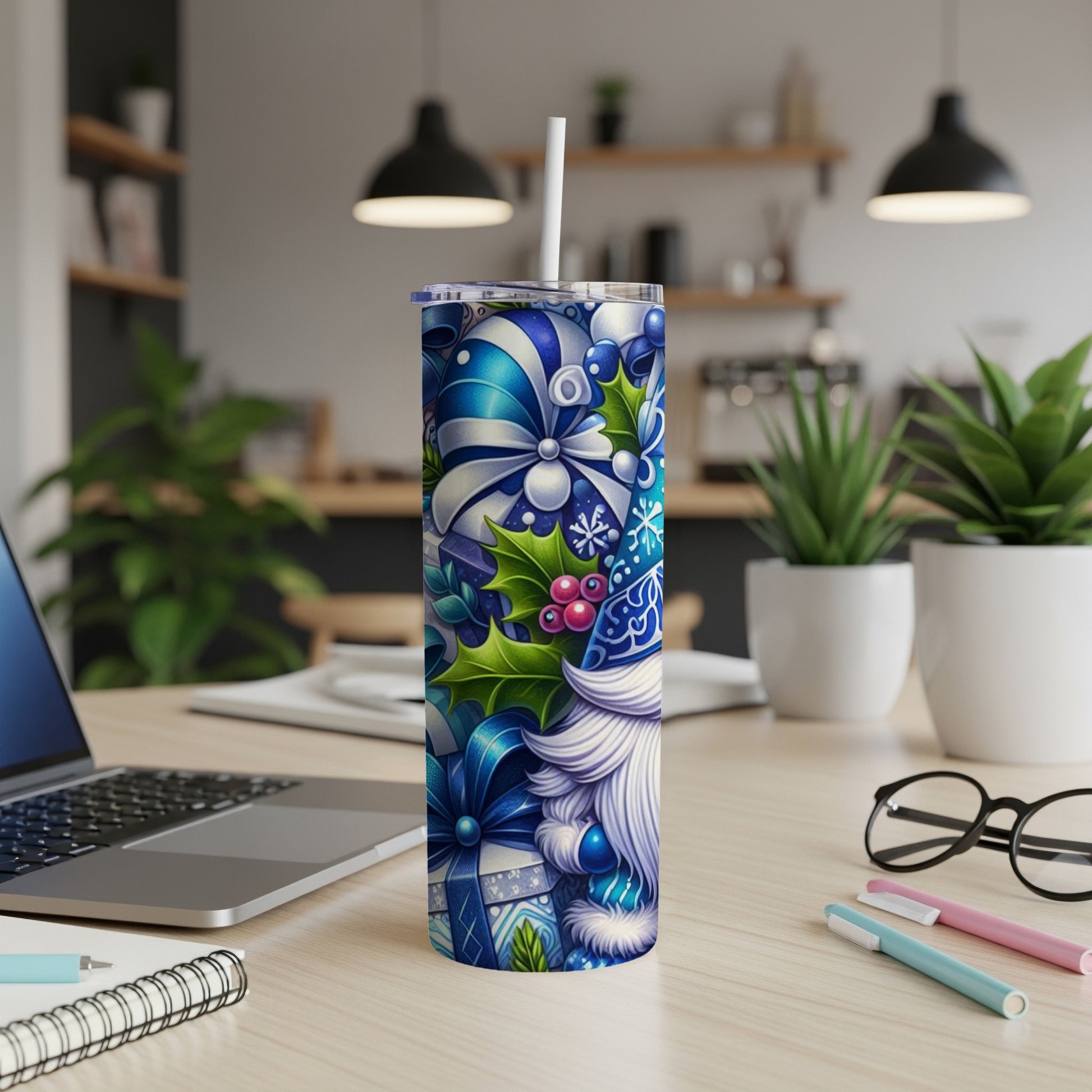 Blue and white gnome design on a skinny tumbler with a straw.